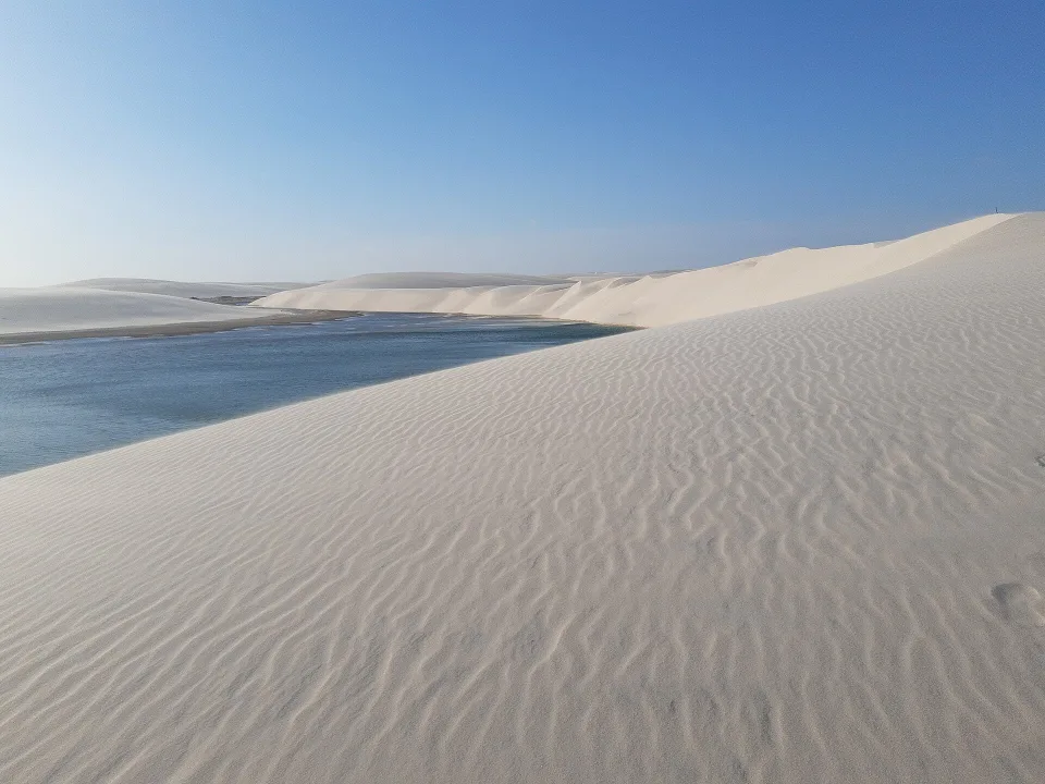 Lagoon between high dunes in Lençóis Maranhenses National Park